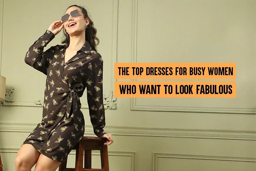 Woman in floral wrap dress and sunglasses posing confidently in a stylish indoor setting