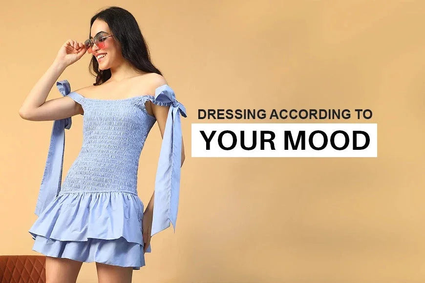 Woman in light blue off-shoulder smocked dress with ruffle hem, smiling with sunglasses, fashion banner background