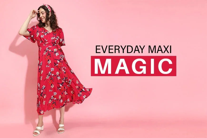Woman in bright red floral maxi dress posing on pink background, stylish summer fashion