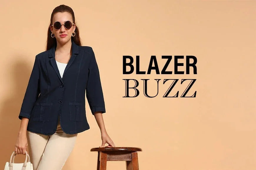 Woman in navy blue blazer and beige pants modeling stylish plus size fashion