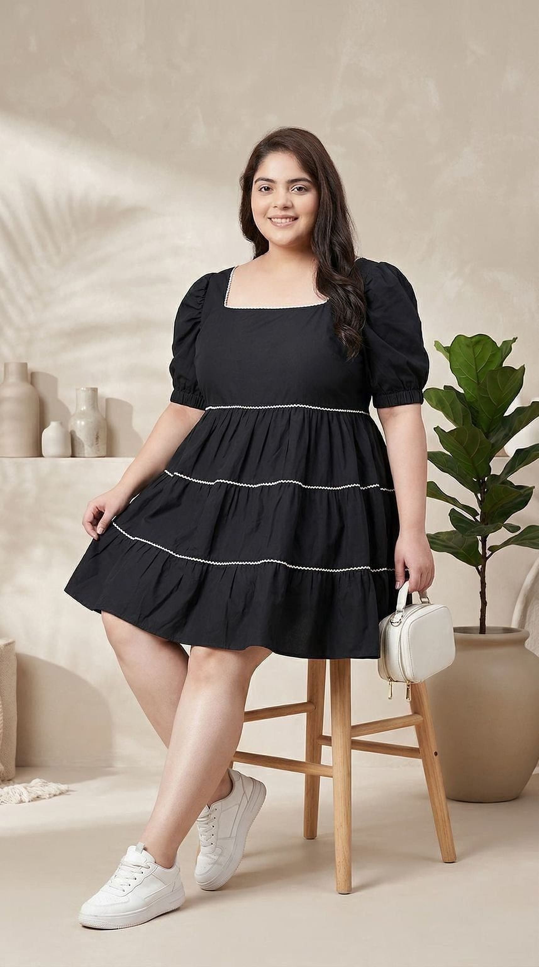 oxolloxo black cotton tiered mini dress with square neckline and puffed sleeves, white piping detail.