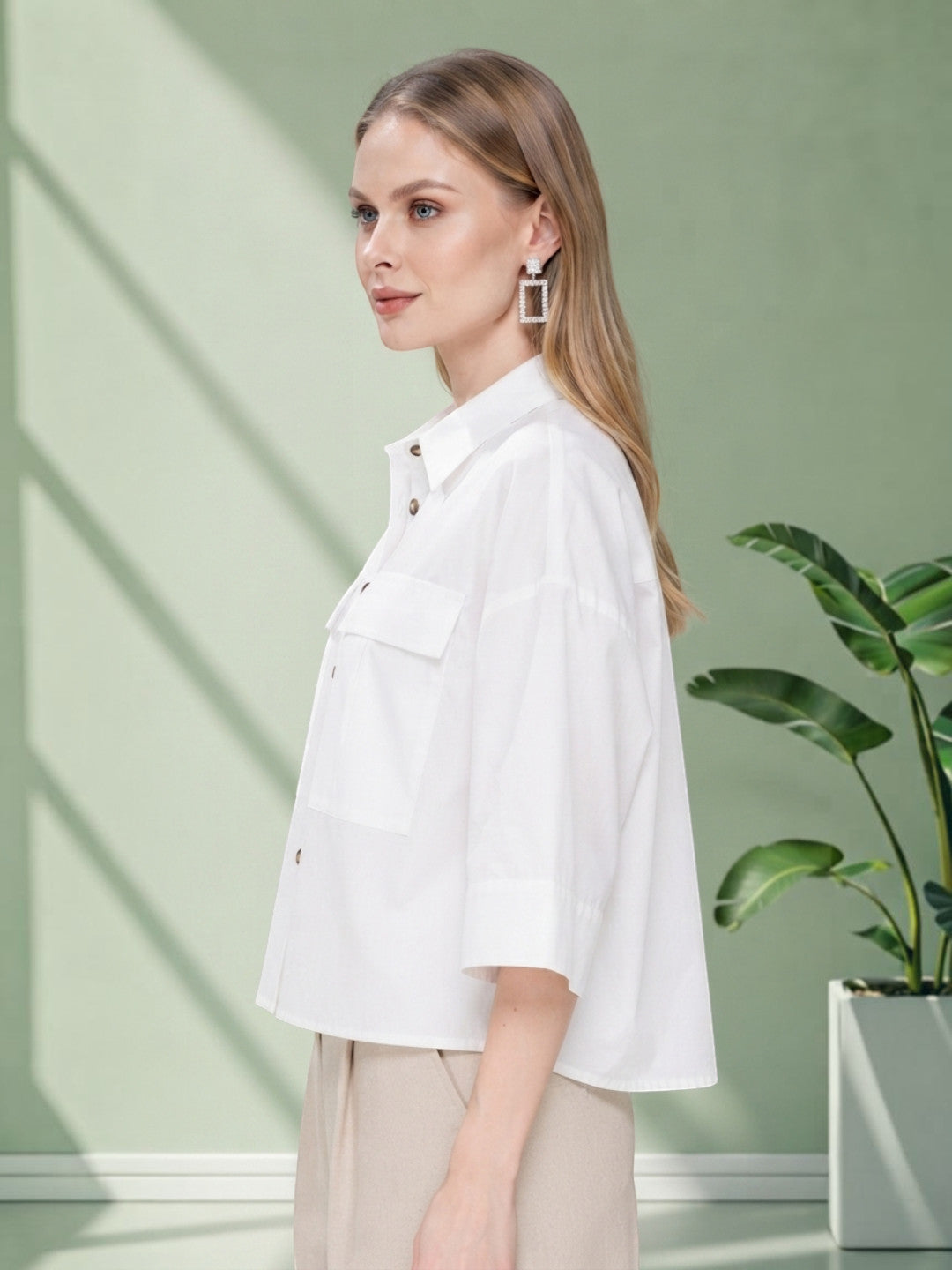 White oversized button-up shirt with chest pocket, stylish women's fashion top