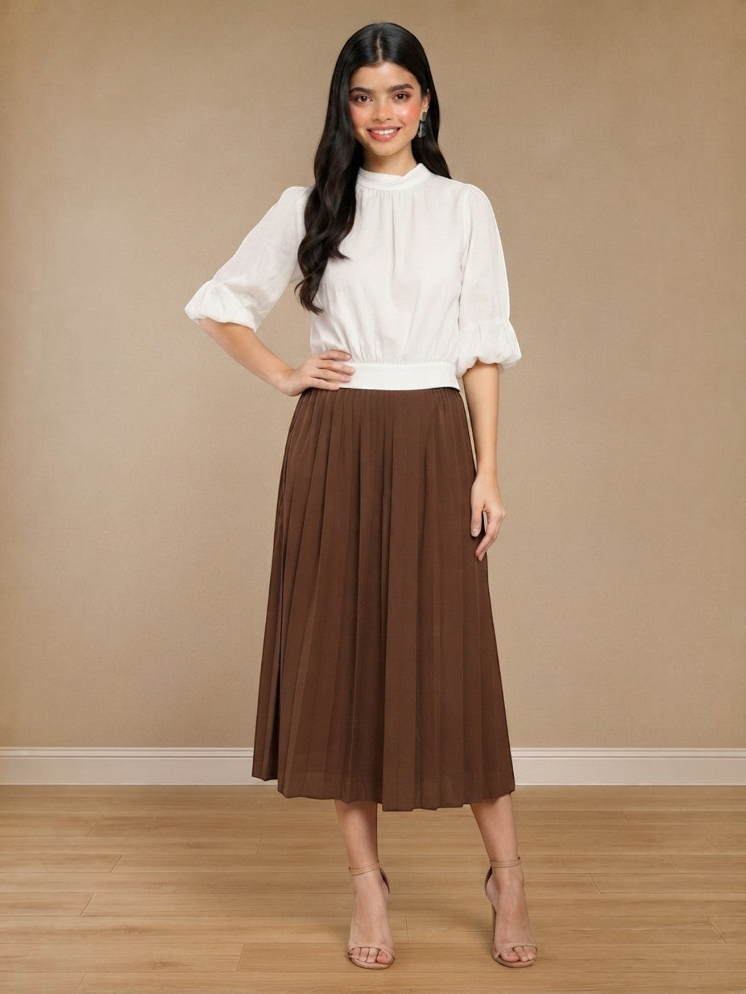 Brown pleated midi skirt with white puff sleeve top, stylish women's fashion outfit