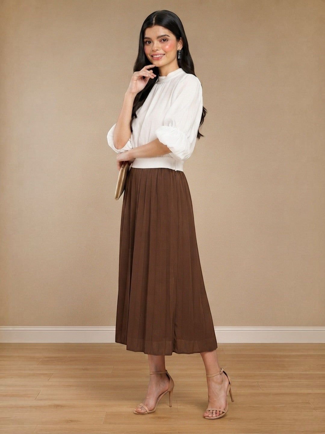 Woman in white blouse and brown pleated midi skirt, stylish plus size fashion outfit