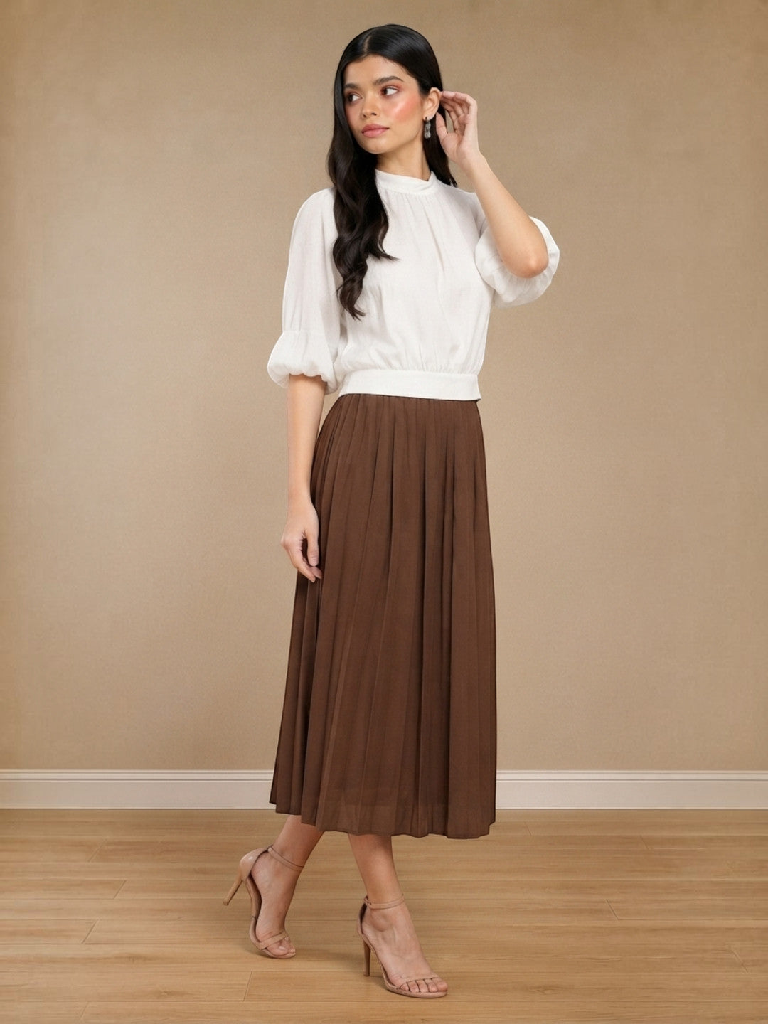 Woman in white blouse and brown pleated midi skirt, stylish plus size fashion outfit
