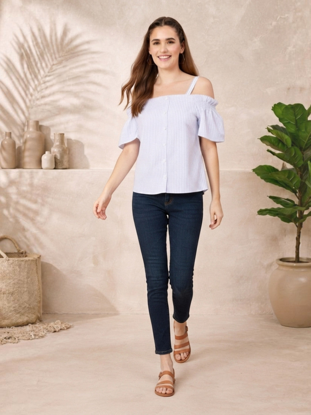 Woman in striped off-shoulder top and skinny jeans, casual summer outfit for women