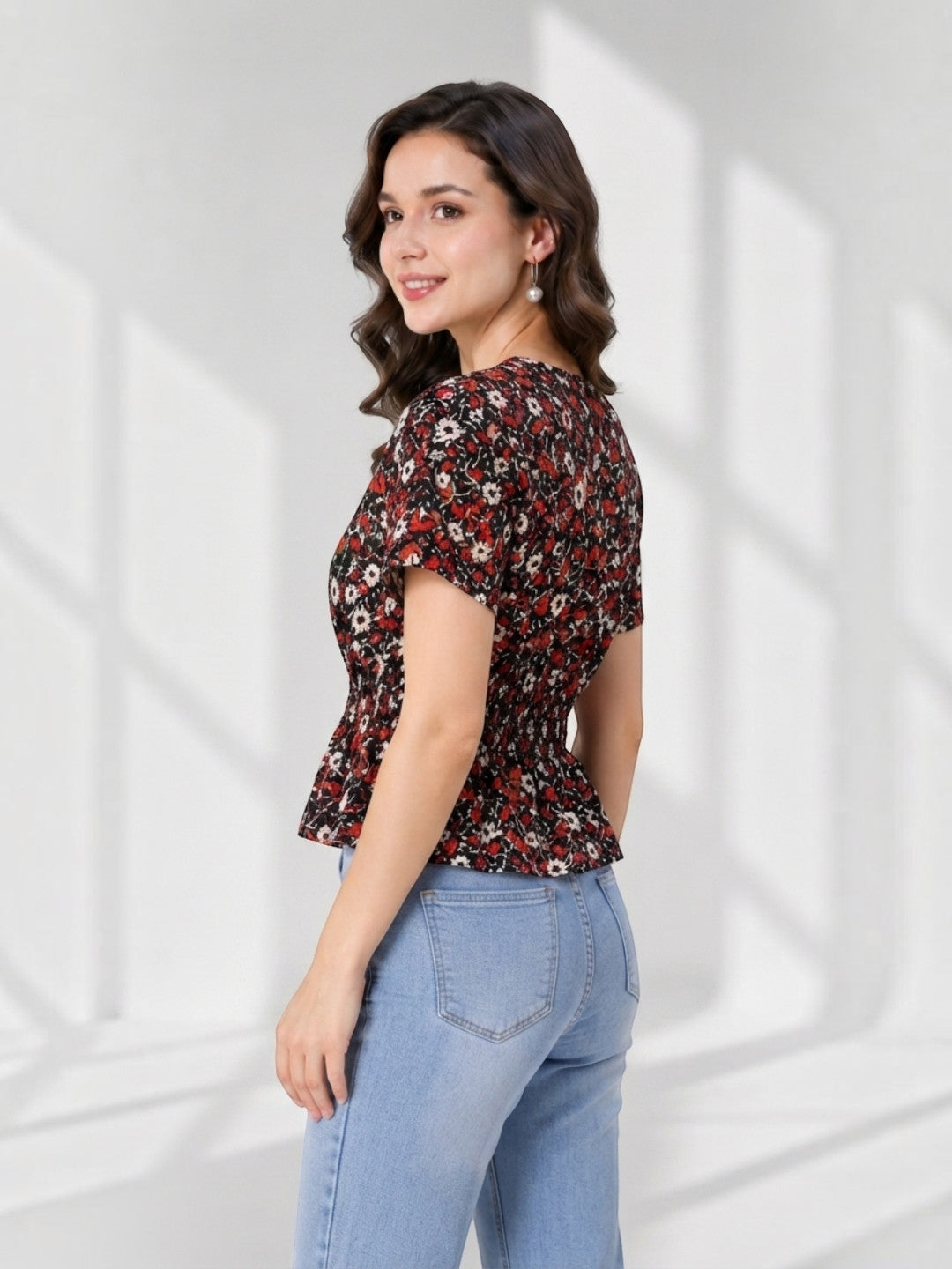Floral peplum top with short sleeves, paired with light blue jeans for women's fashion