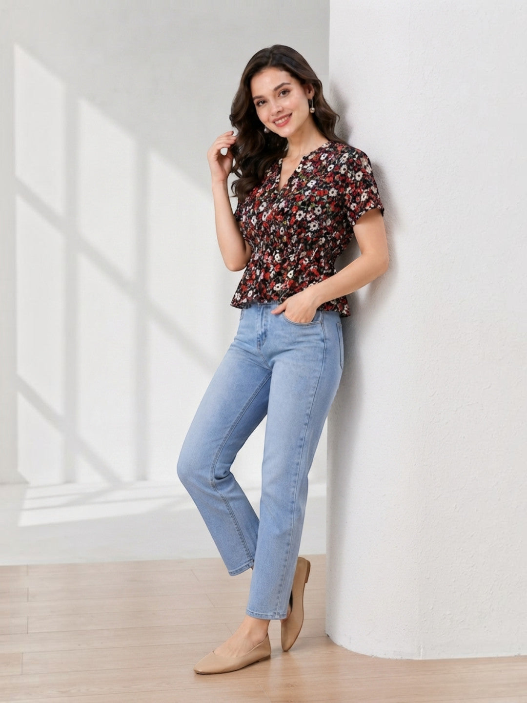 Woman in floral print top and light wash jeans, stylish casual outfit for women