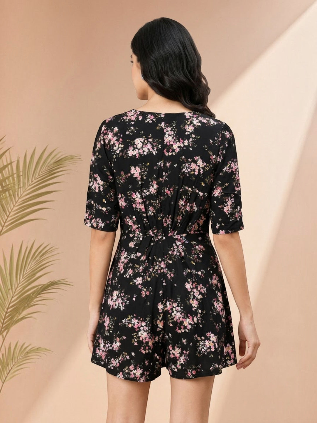 Black floral print romper with short sleeves and back tie detail for women's fashion