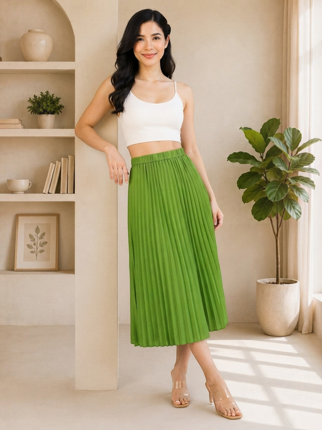 Green pleated midi skirt with white crop top, stylish women's fashion outfit