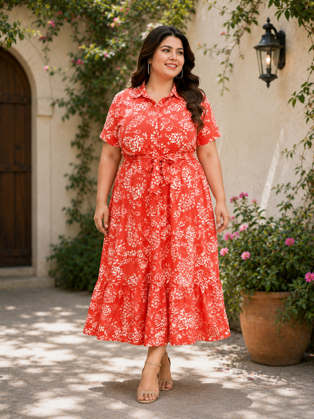 Plus size woman in red floral midi dress with tie waist, perfect for summer fashion