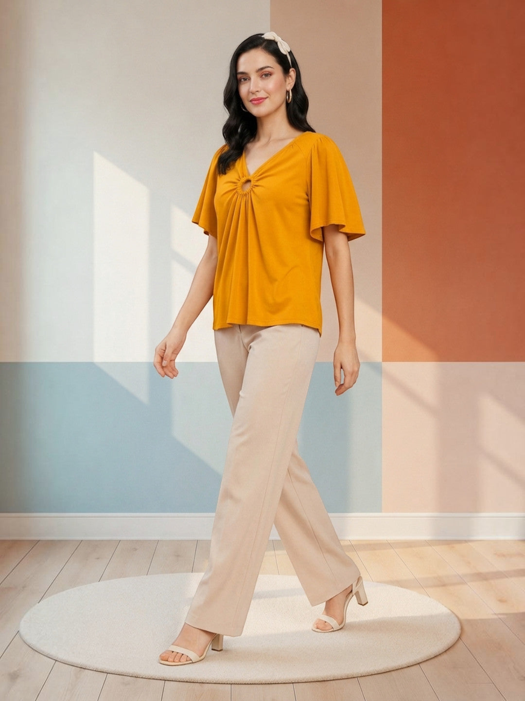 Mustard yellow ruched top with wide sleeves paired with beige wide-leg pants for women's fashion