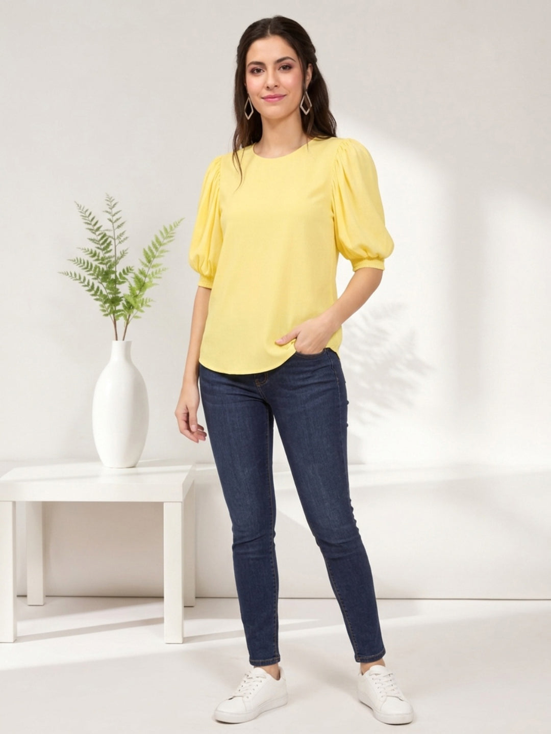 Yellow puff sleeve top with blue jeans and white sneakers for women's fashion