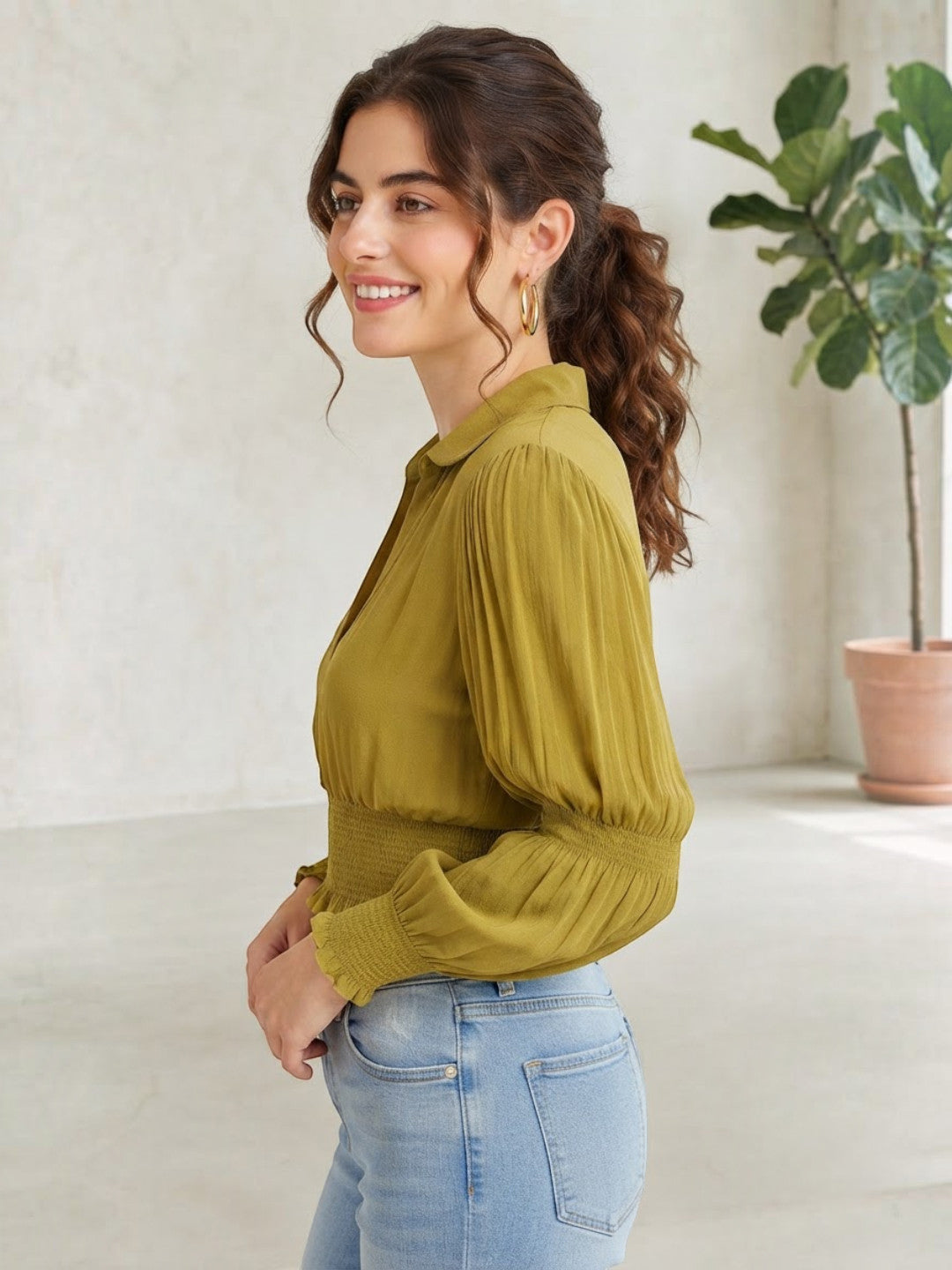 Olive green pleated long sleeve blouse with smocked waist, paired with light wash jeans for women's fashion