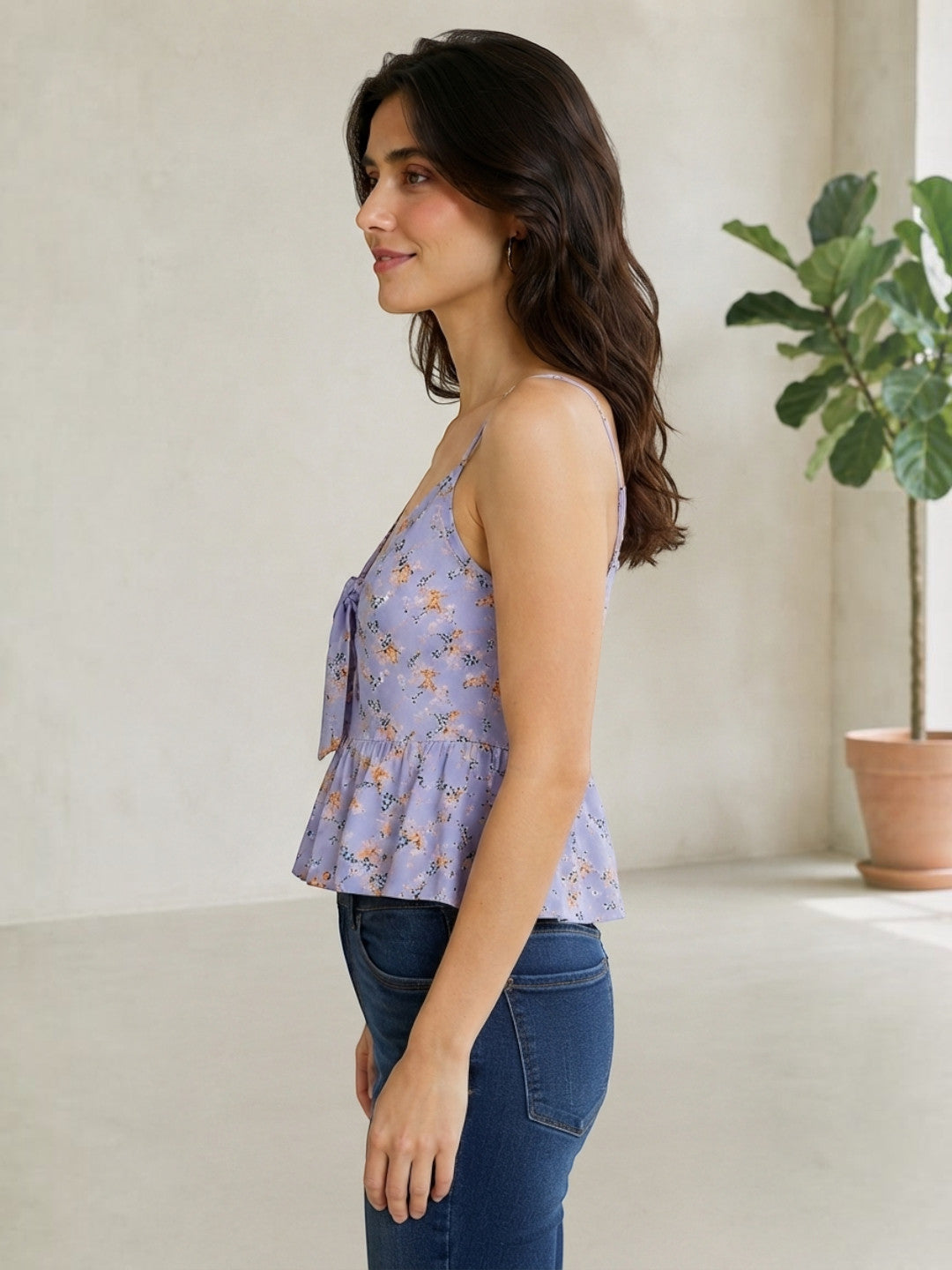 Lavender floral peplum top with tie front, paired with blue jeans for women's fashion