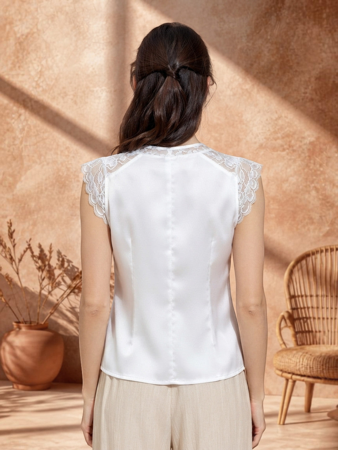 White sleeveless blouse with lace shoulders for women, back view, plus size fashion
