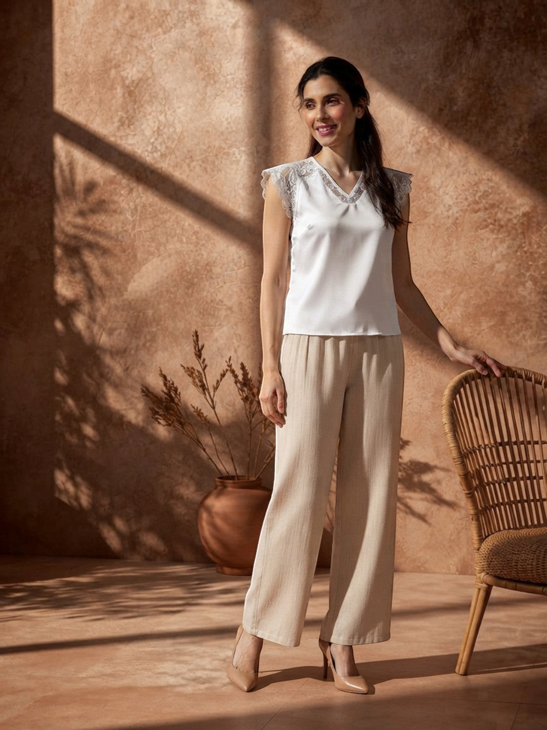 White lace-trim sleeveless top with beige wide-leg pants, stylish plus size women's fashion outfit