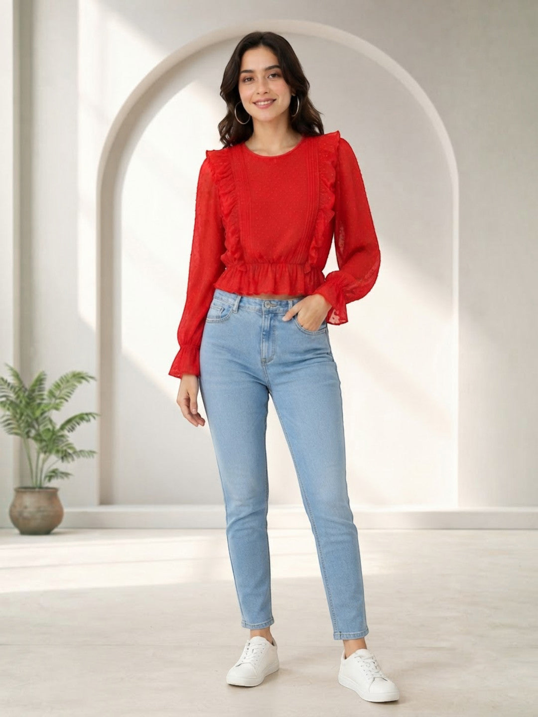 Woman in red ruffle blouse and light blue jeans, stylish plus size fashion outfit