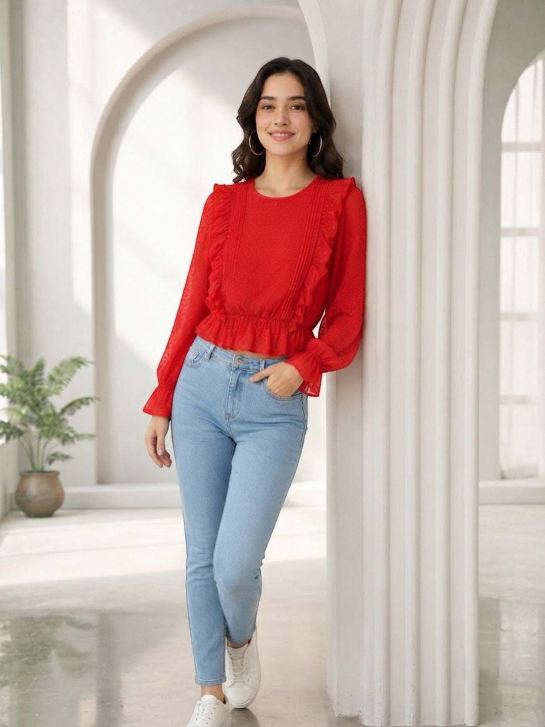 Woman in red ruffled blouse and light blue jeans, stylish plus size fashion outfit
