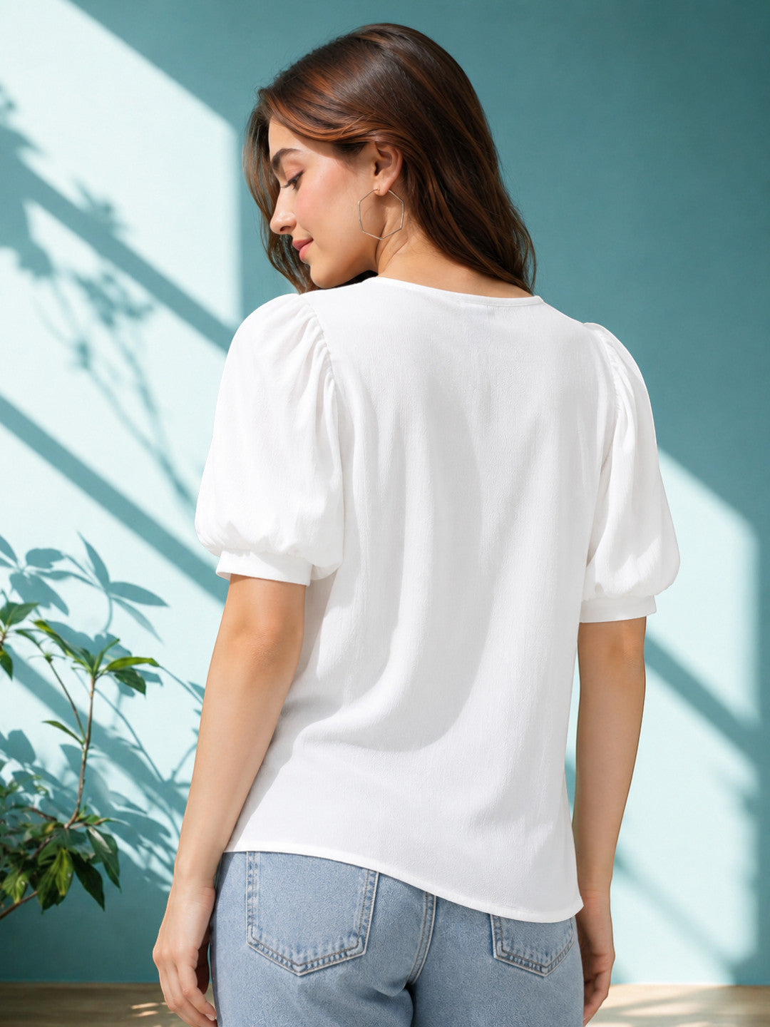 White puff sleeve top for women, stylish summer blouse with relaxed fit, paired with denim jeans