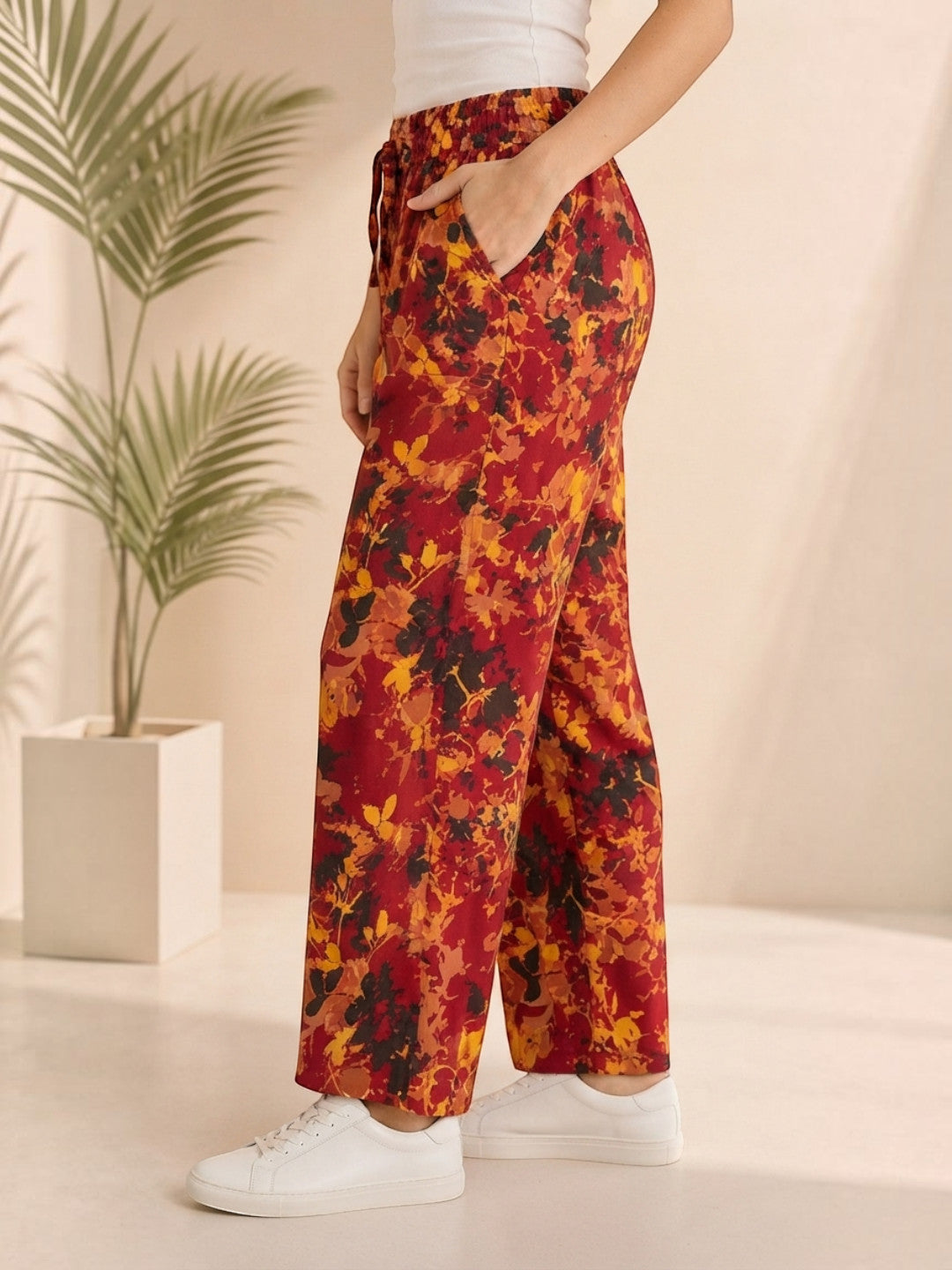 Floral print wide-leg pants in red, orange, black — stylish plus size women's fashion with drawstring waist