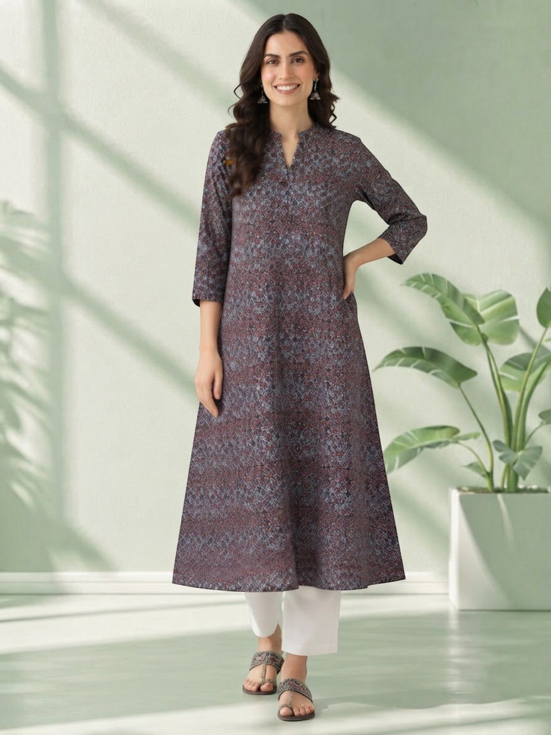 Woman in floral print kurta with white pants, stylish plus size fashion outfit