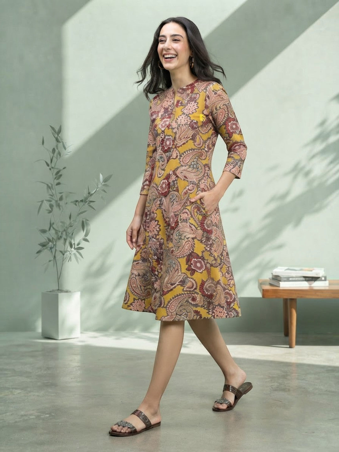 Woman in yellow paisley print midi dress, plus size fashion, stylish casual wear