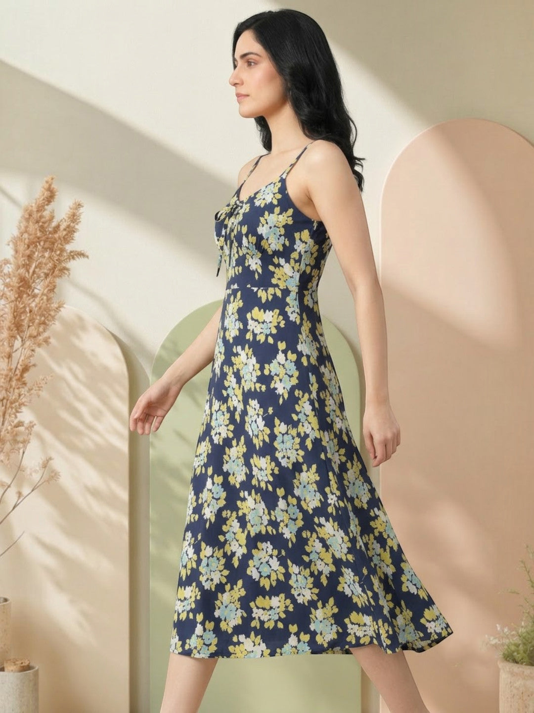Navy blue floral midi dress with thin straps, perfect for women's fashion trends