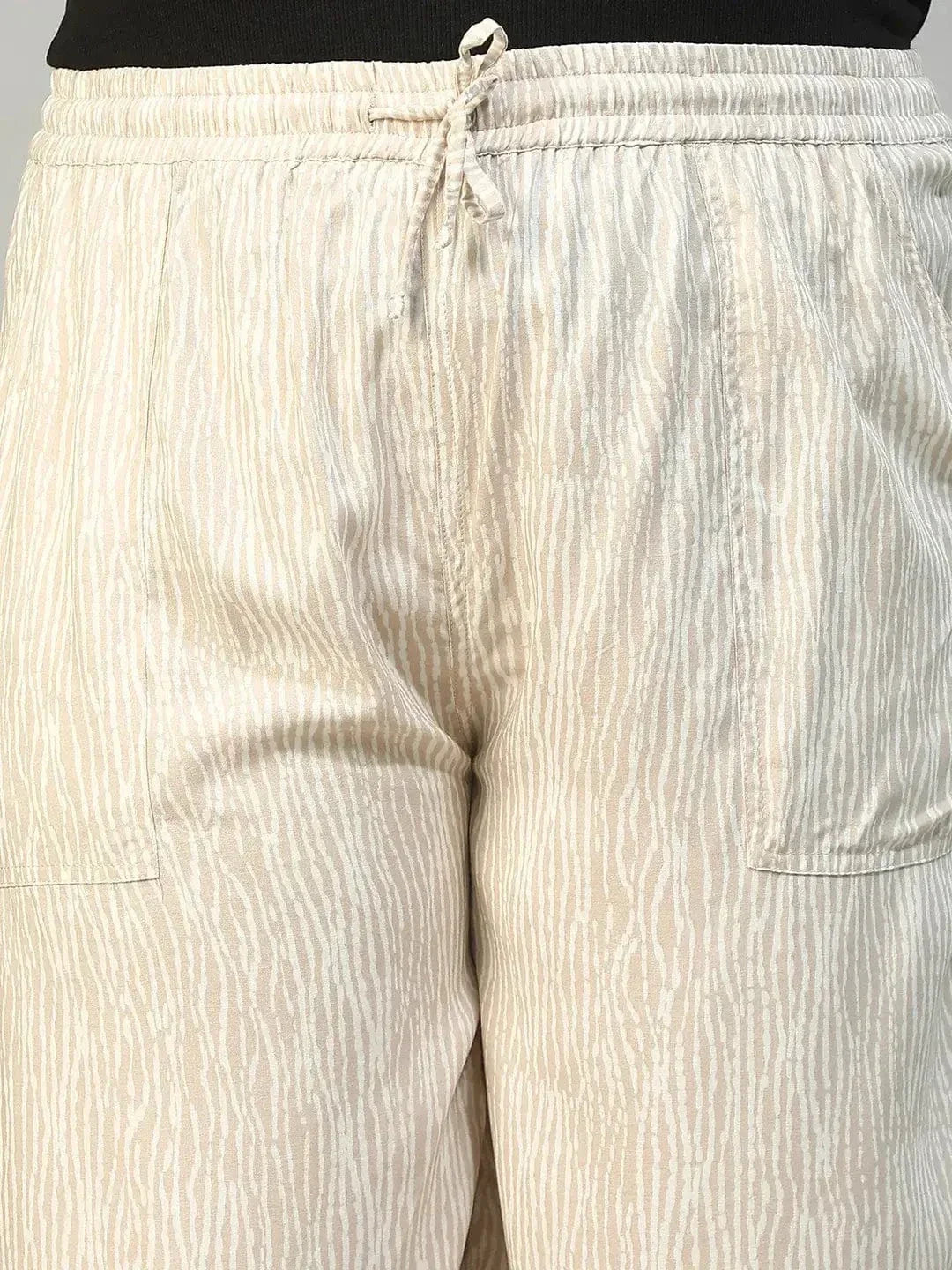 Beige Elasticated With Tie -Up Detail Rayon Dot Print Plus Size Women Flare Pant - oxolloxo