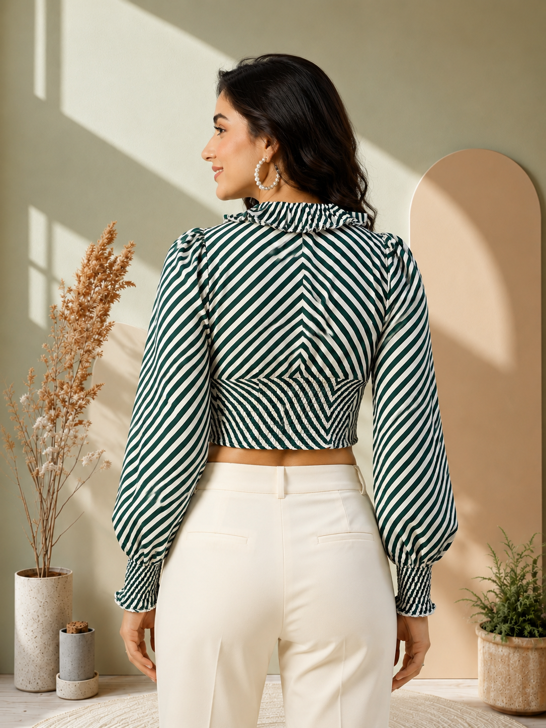 Green and white striped crop top with puff sleeves, paired with cream pants for women's fashion