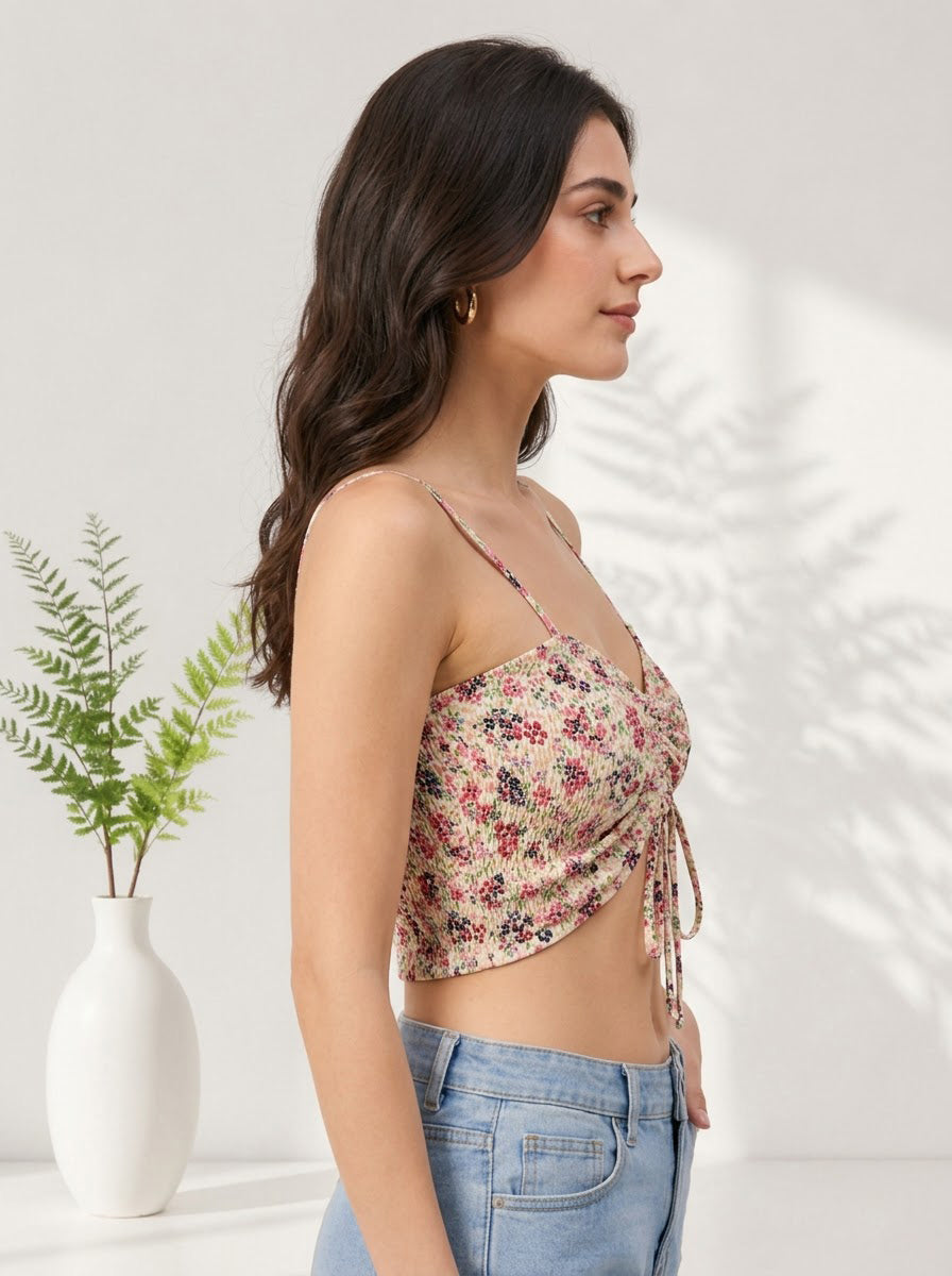 Floral print crop top with side tie, paired with denim jeans, perfect for trendy women's fashion
