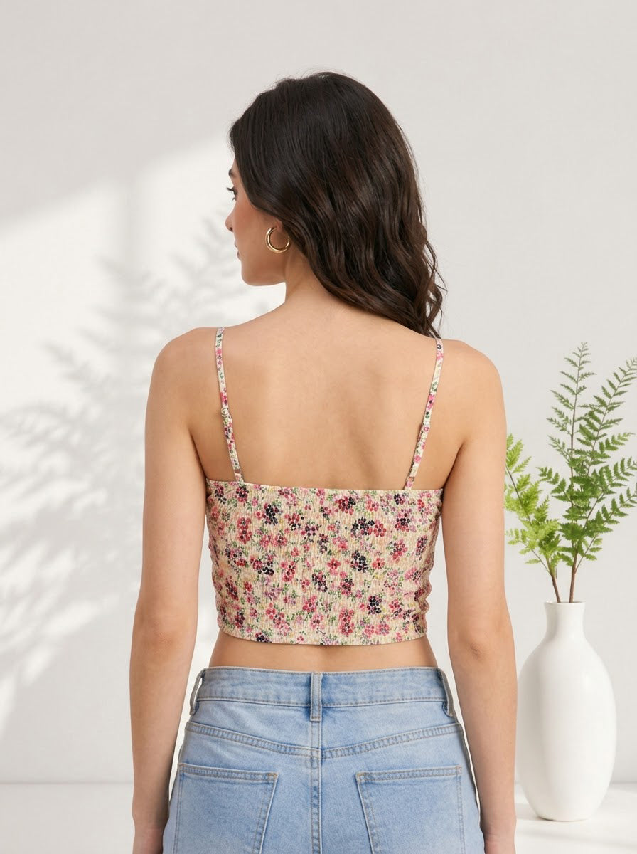 Floral print crop top with thin straps, paired with high-waist jeans, stylish women's fashion