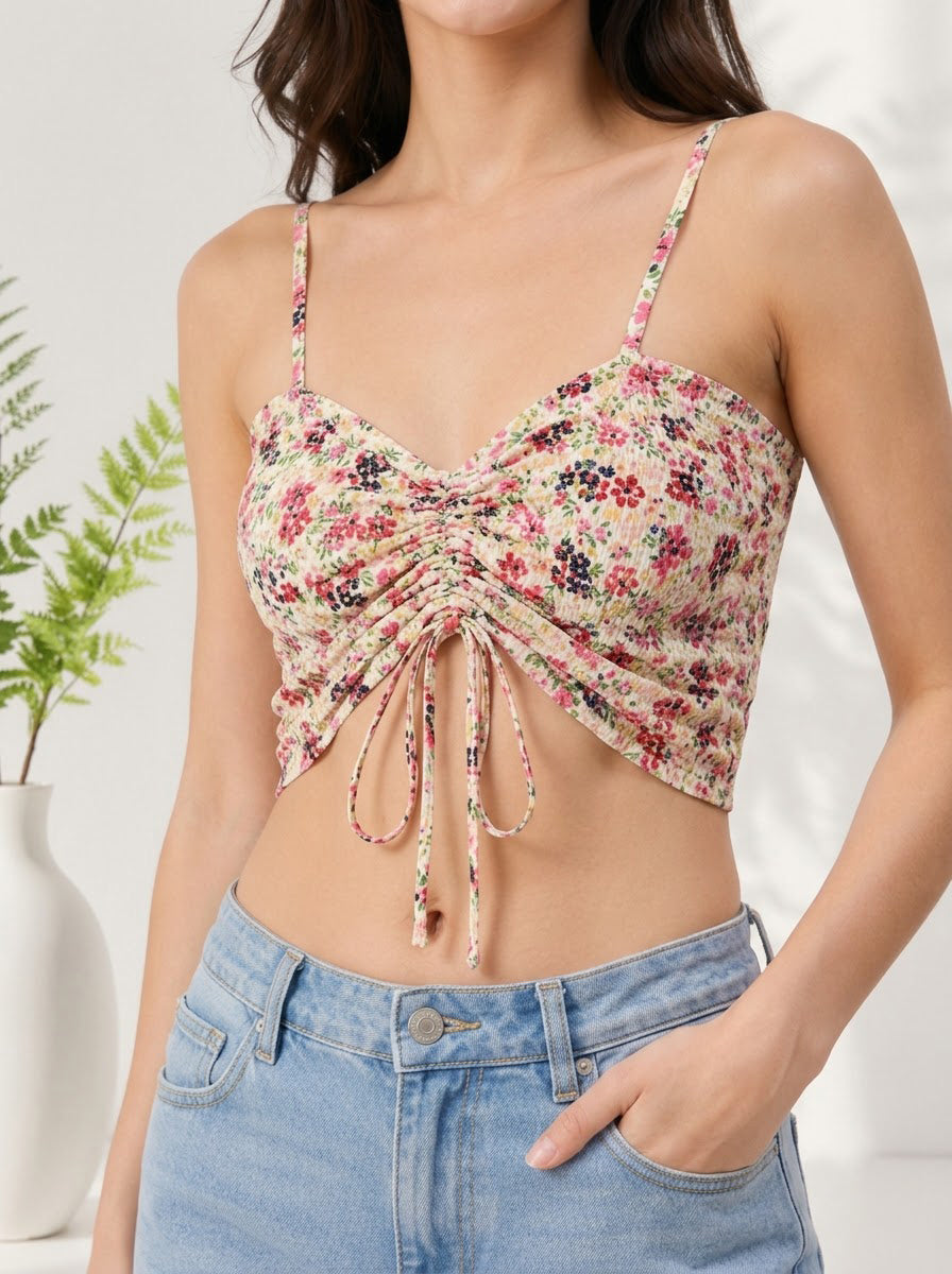 Floral ruched crop top with front tie, paired with high-waist denim shorts for trendy summer women's fashion