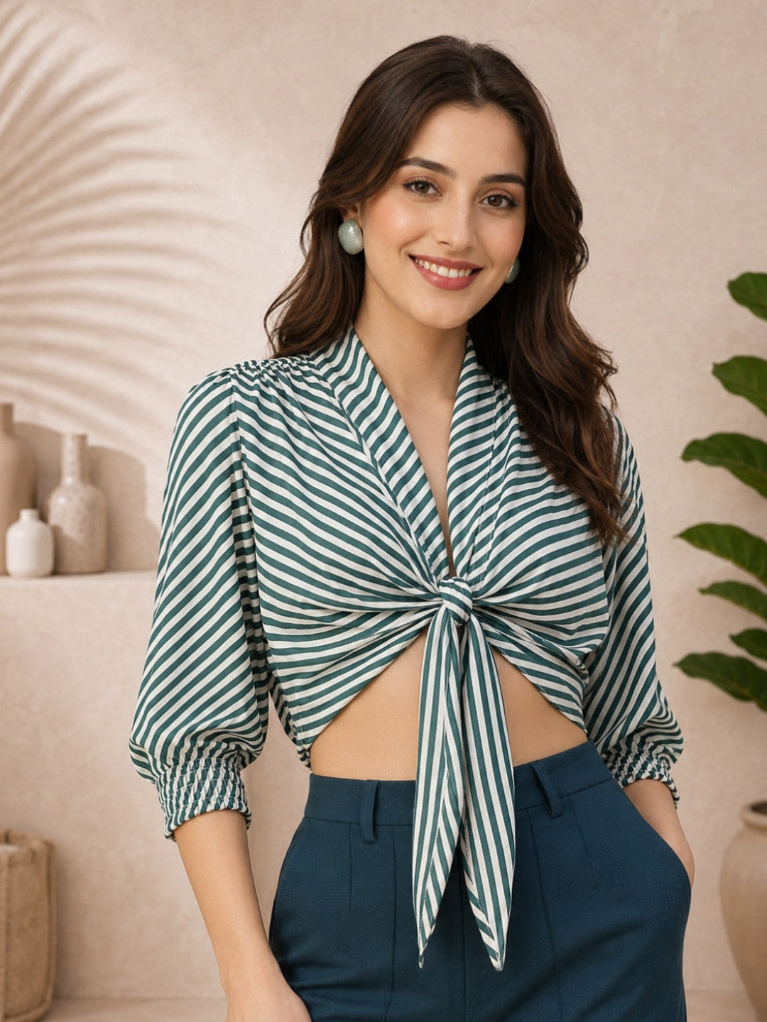 Green and white striped tie-front blouse with puff sleeves, paired with navy high-waist pants for women's fashion.