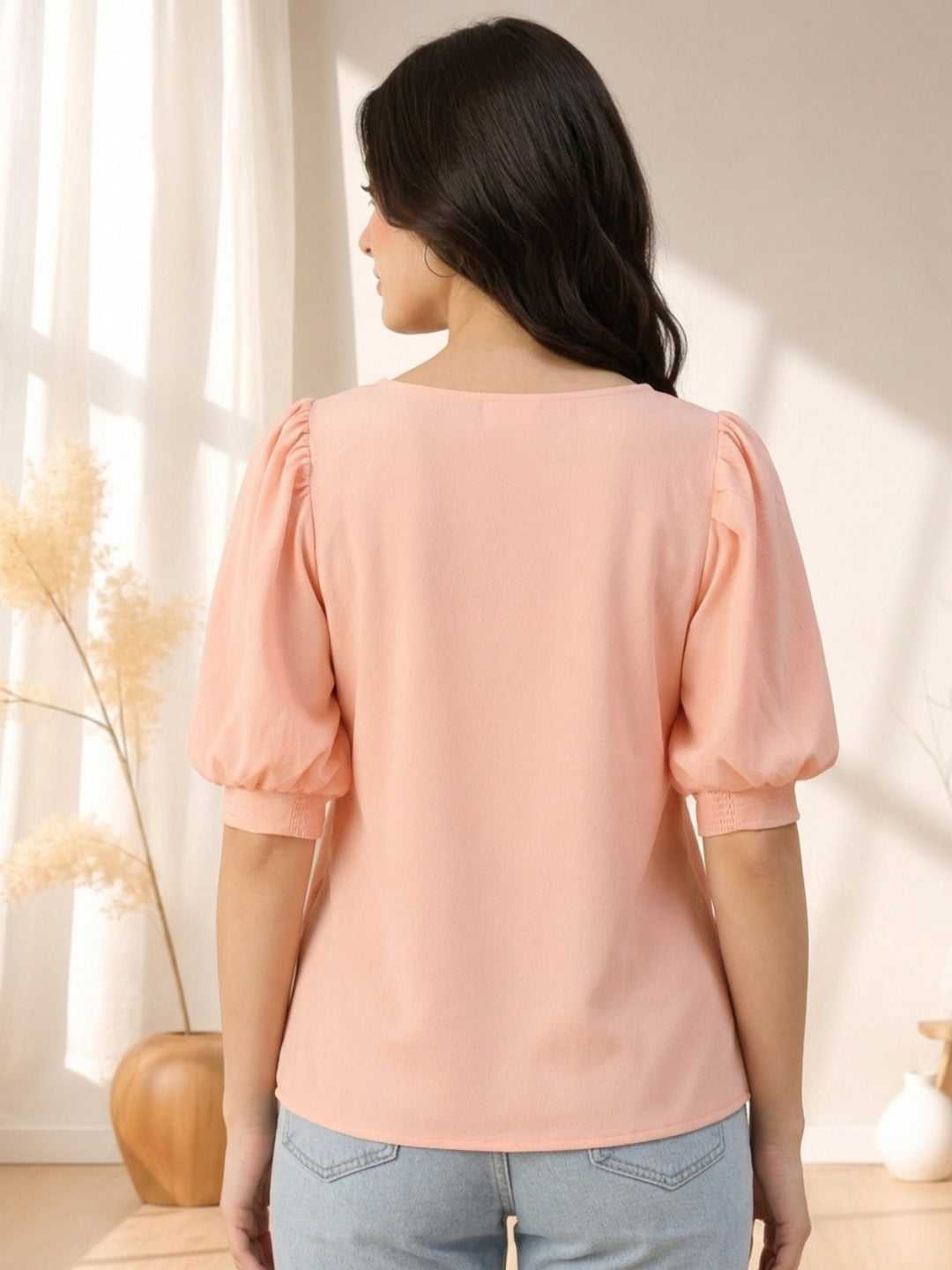 Pink puff sleeve top for women, back view, paired with jeans, soft fabric, stylish casual wear