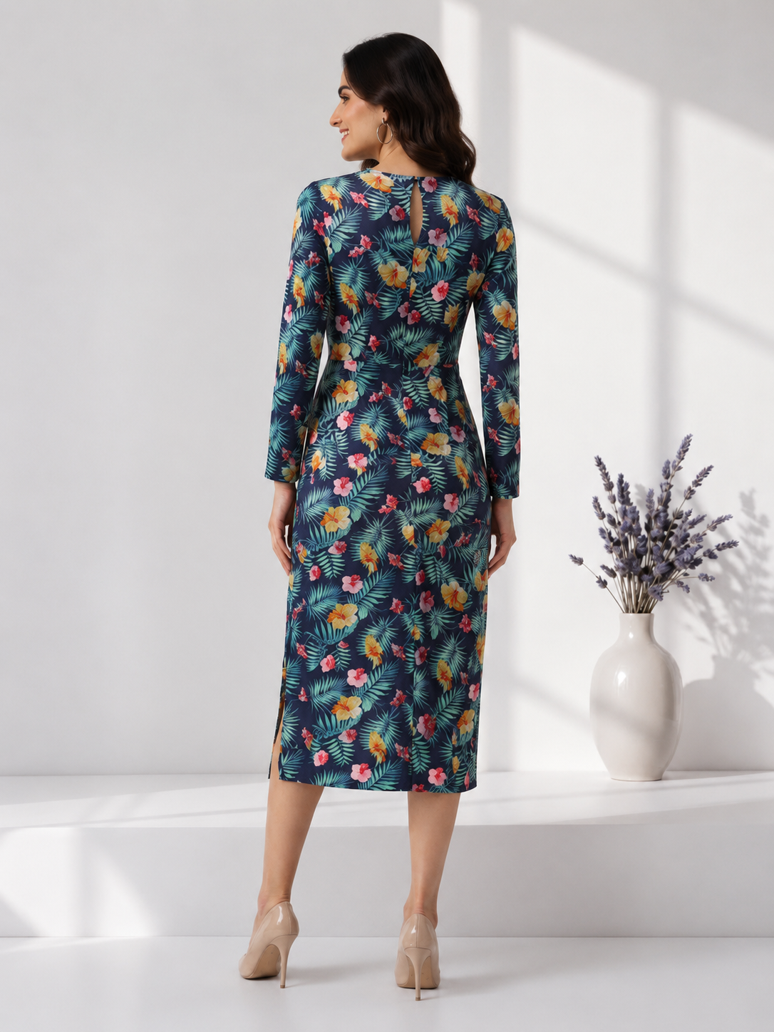 Woman in navy floral print midi dress with back slit, perfect for plus size & regular fashion