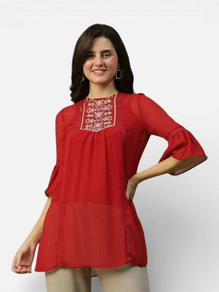 Woman wearing red embroidered tunic top with flared sleeves, women's fashion clothing