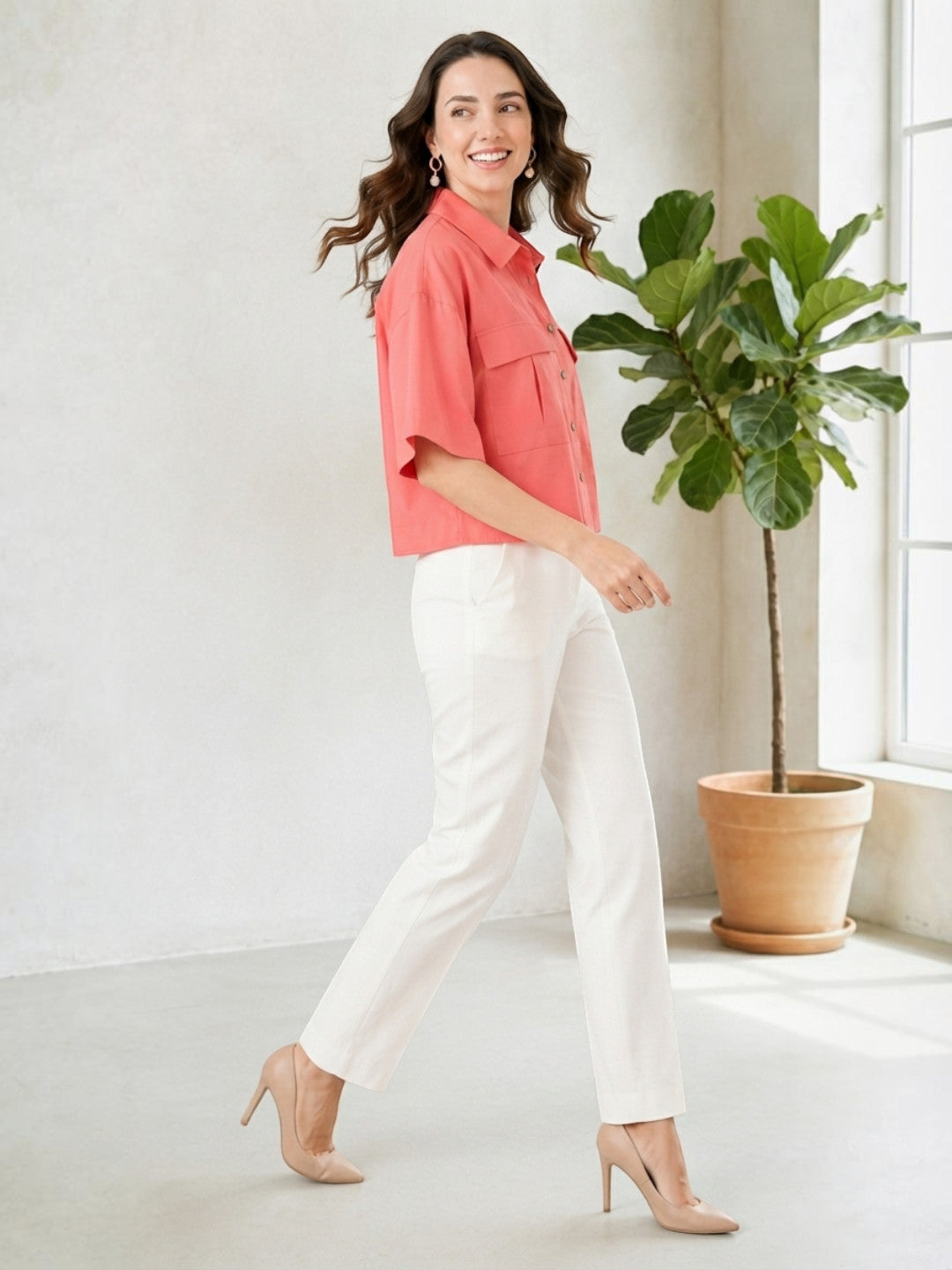Woman in coral short sleeve shirt & white pants, stylish plus size fashion outfit