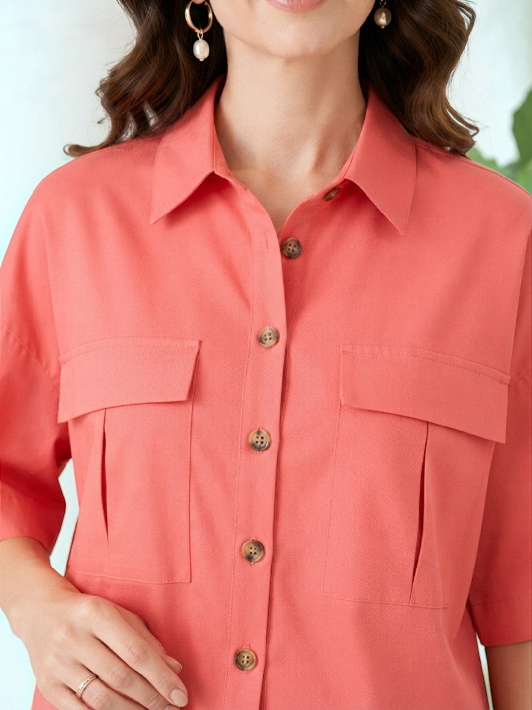 Coral button-up shirt with chest pockets for women's fashion