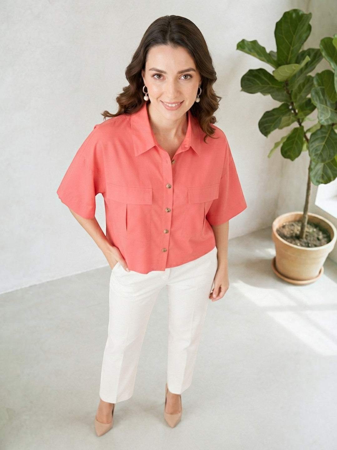 Coral button-up shirt with white pants, stylish women's fashion outfit