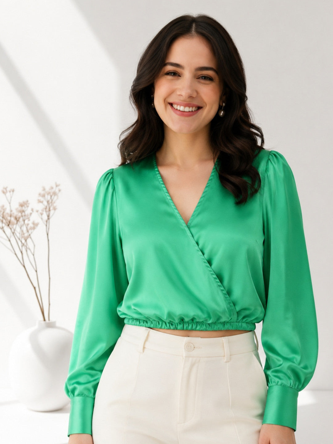 Green satin wrap top with puff sleeves, paired with cream high-waist pants for women's fashion