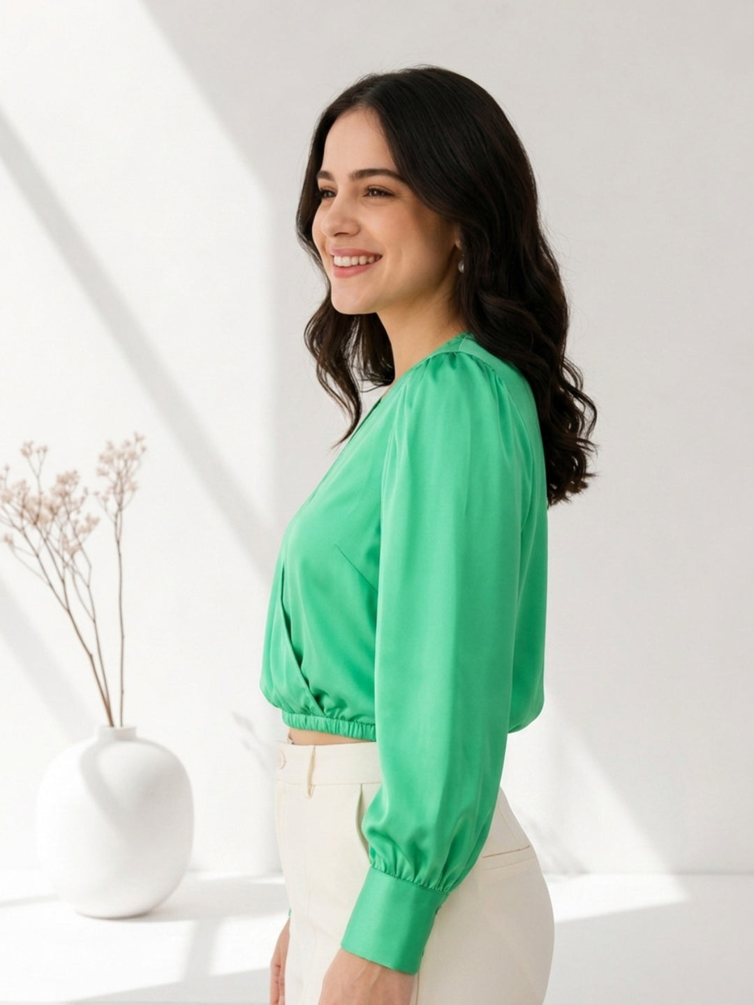 Woman in green satin blouse with puff sleeves, paired with white pants, for plus size & regular women's fashion