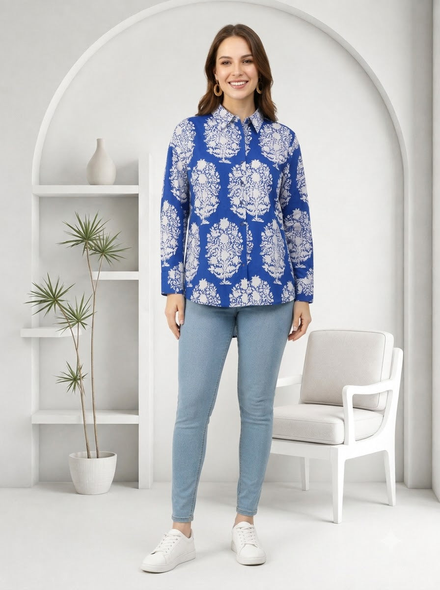 Woman wearing blue floral print blouse with light jeans, stylish plus size fashion outfit