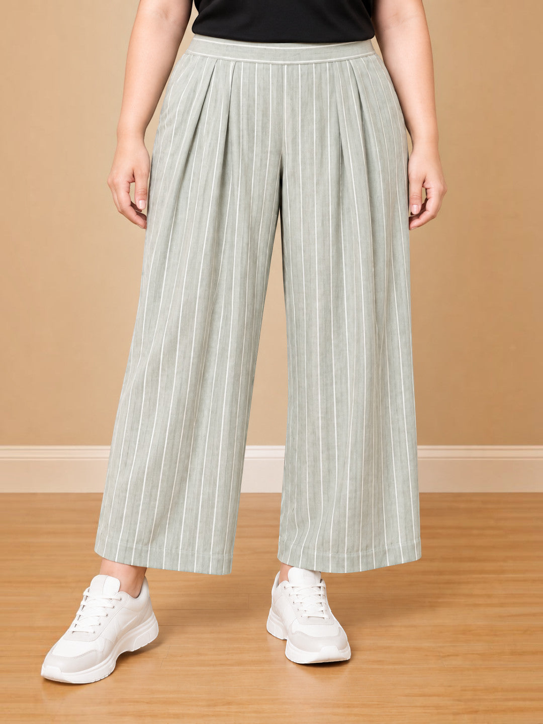 Women plus size light green striped cotton linen trousers - front view