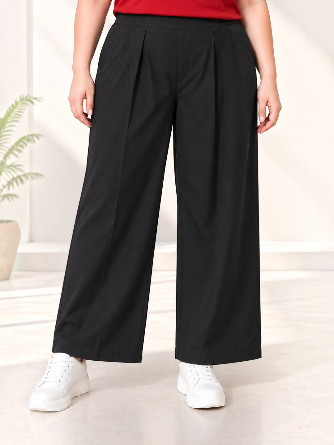 Women plus size black solid cotton trousers - front view