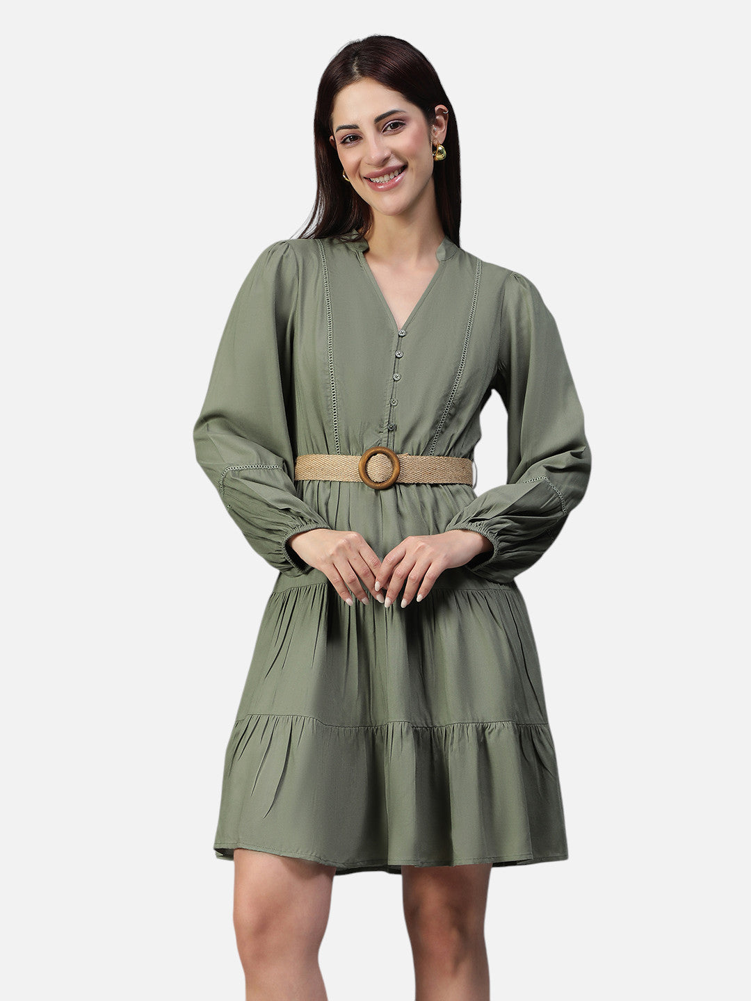 Woman wearing olive green long sleeve belted mini dress with tiered skirt