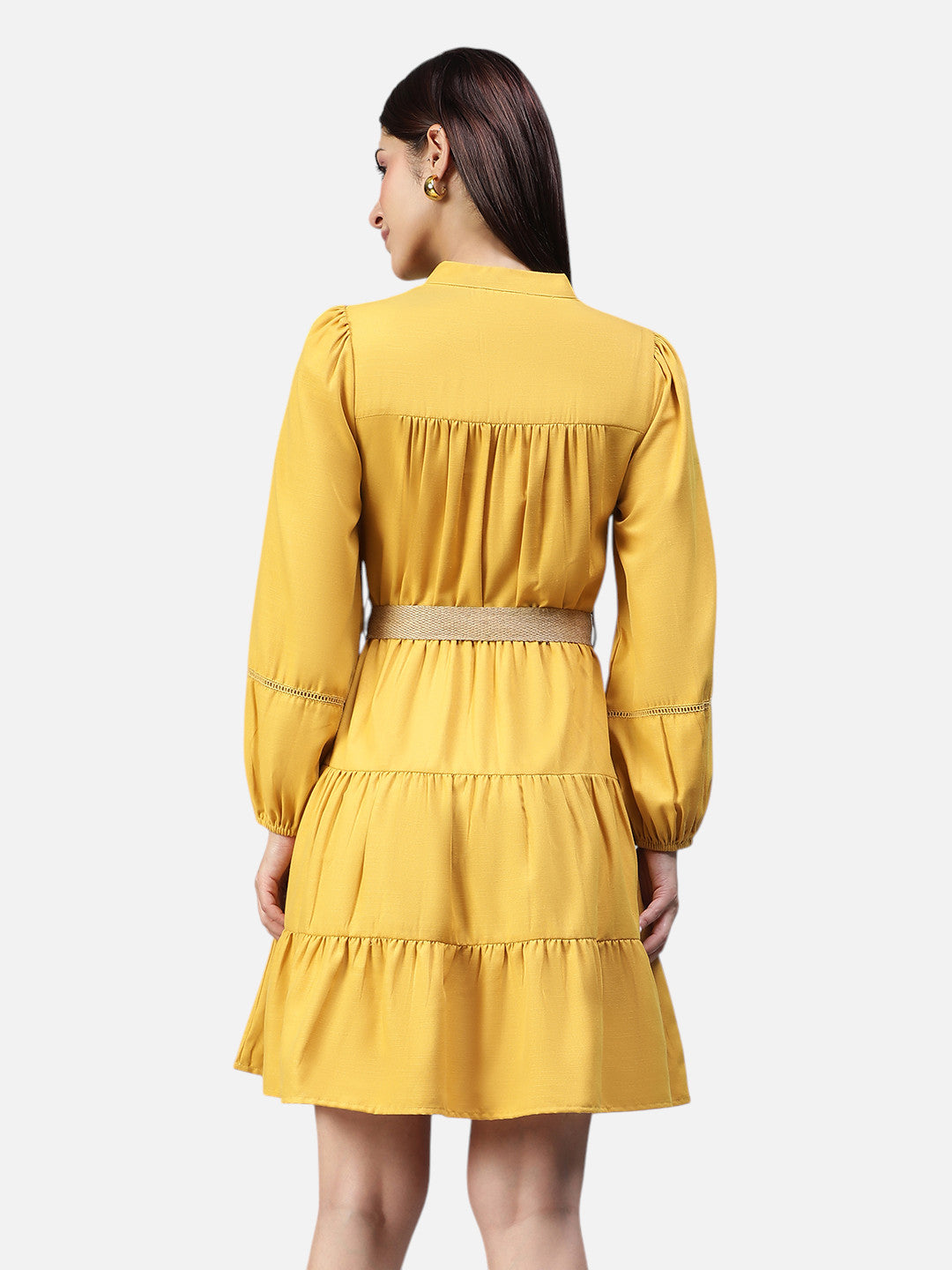 Woman wearing yellow long sleeve tiered mini dress, back view, fashion clothing