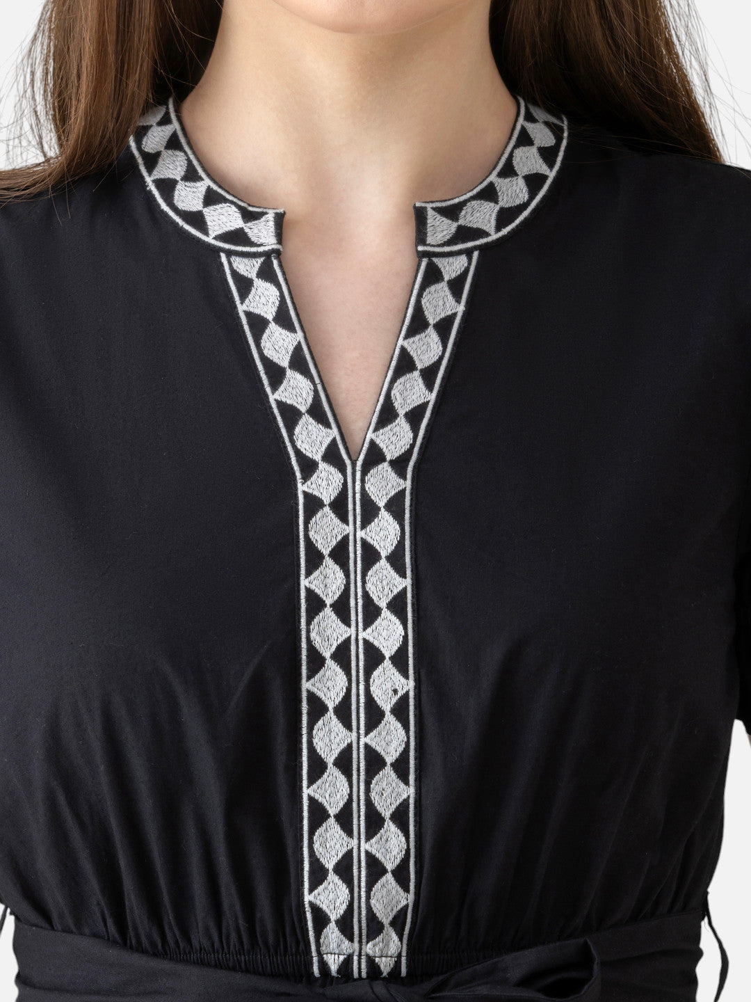 Black women's dress with geometric embroidered neckline and tie waist detail