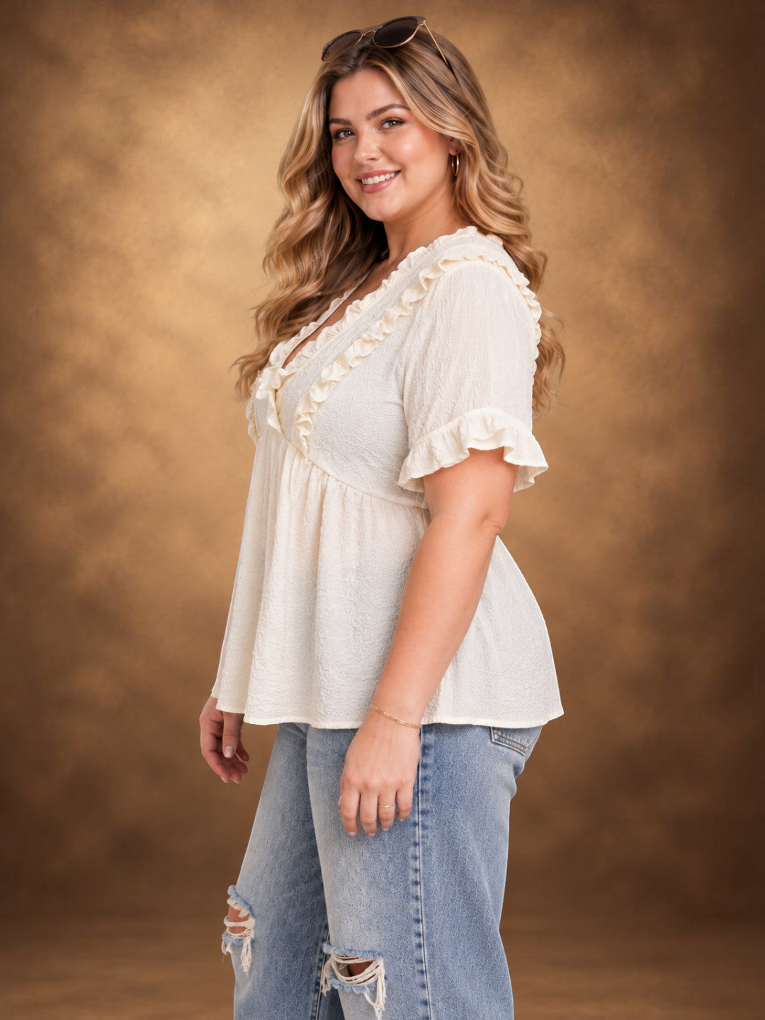 Plus size off white peplum top with ruffle yoke