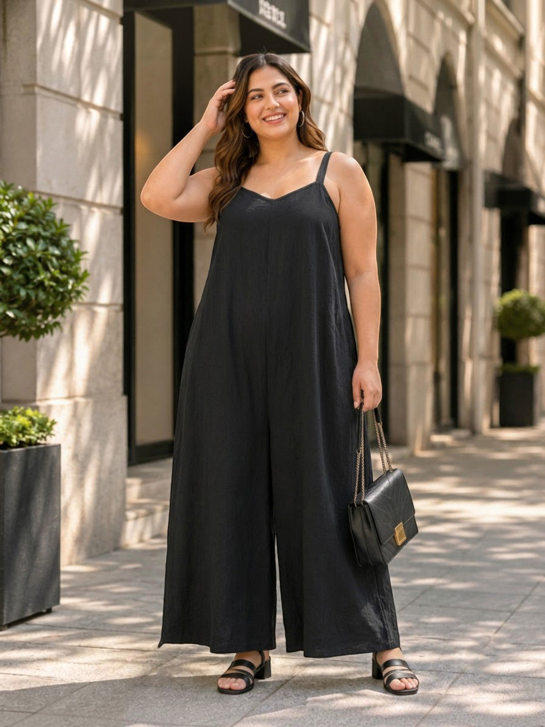 Women Plus Size Solid Black V-Neck Sleeveless Dobby Jumpsuit - image 1